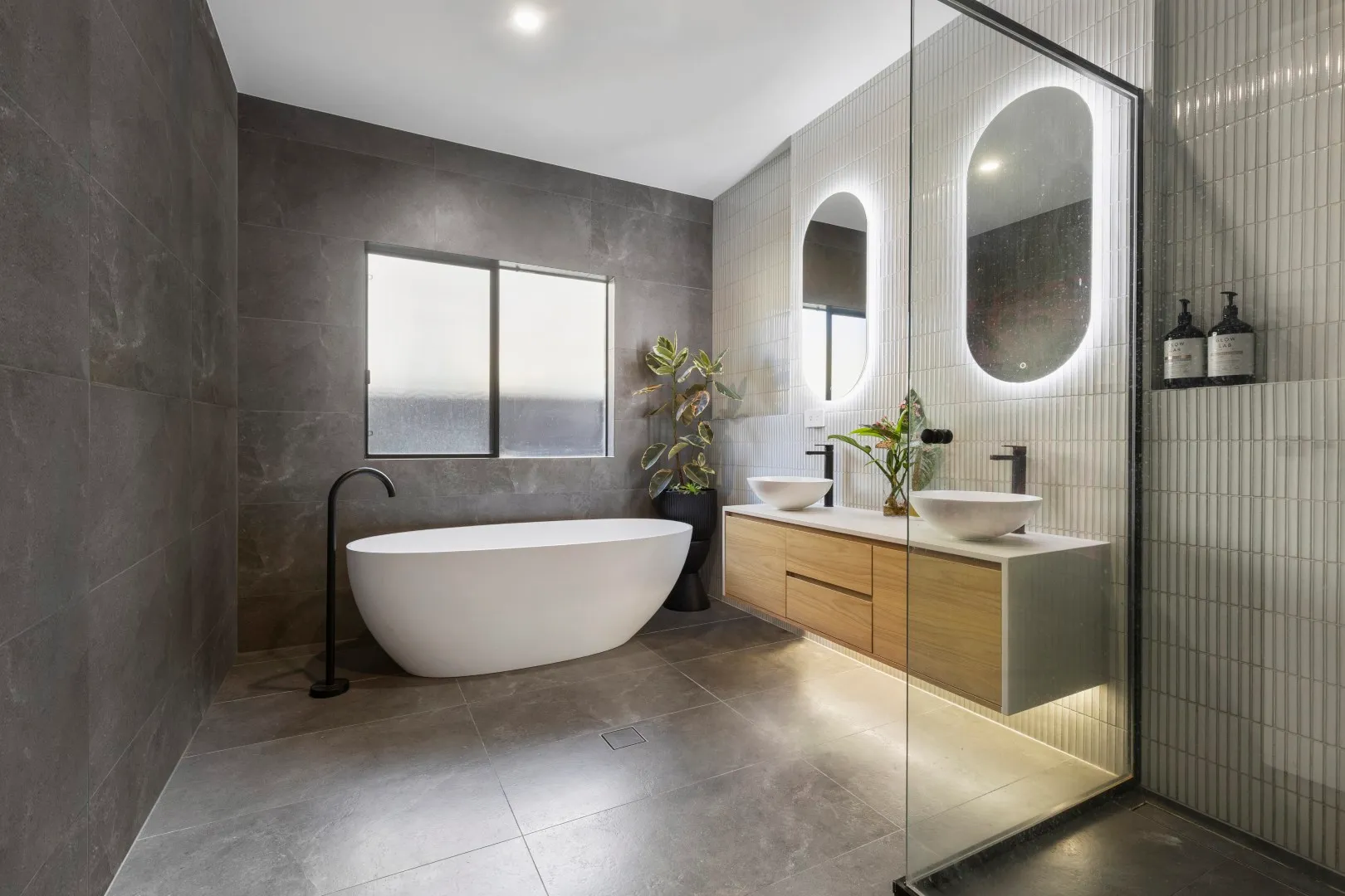 Freestanding tub and floating vanity