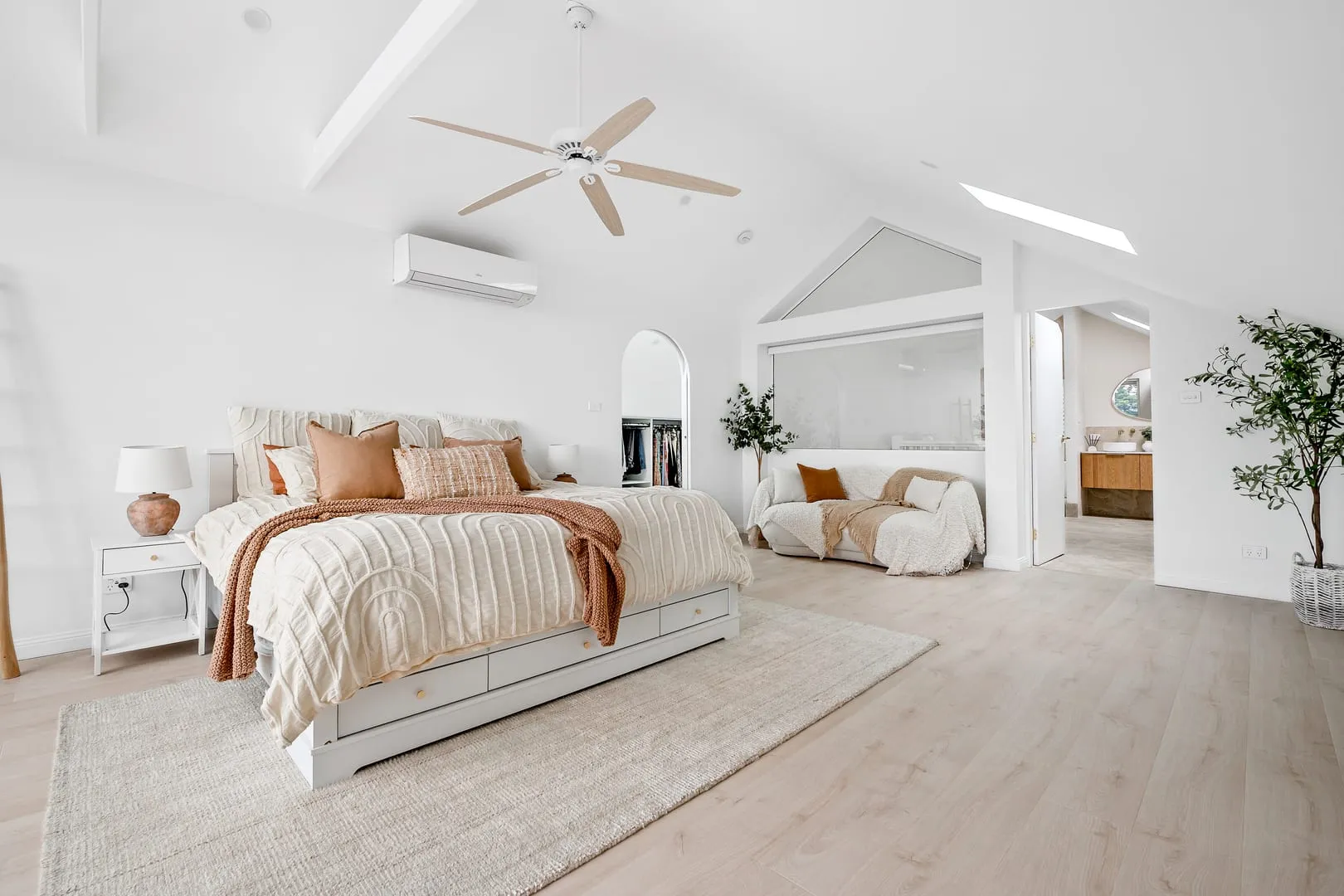 Raked ceiling and skylights over the bed