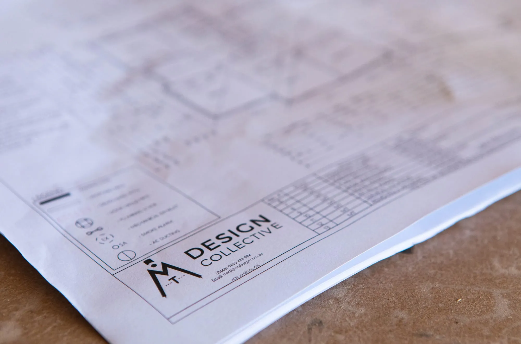 A printed MT Design Collective floor plan set with title block