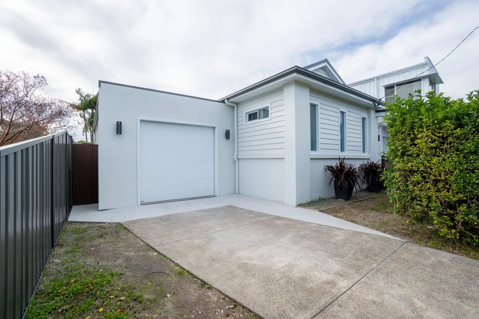Rear garage and weatherboard exterior