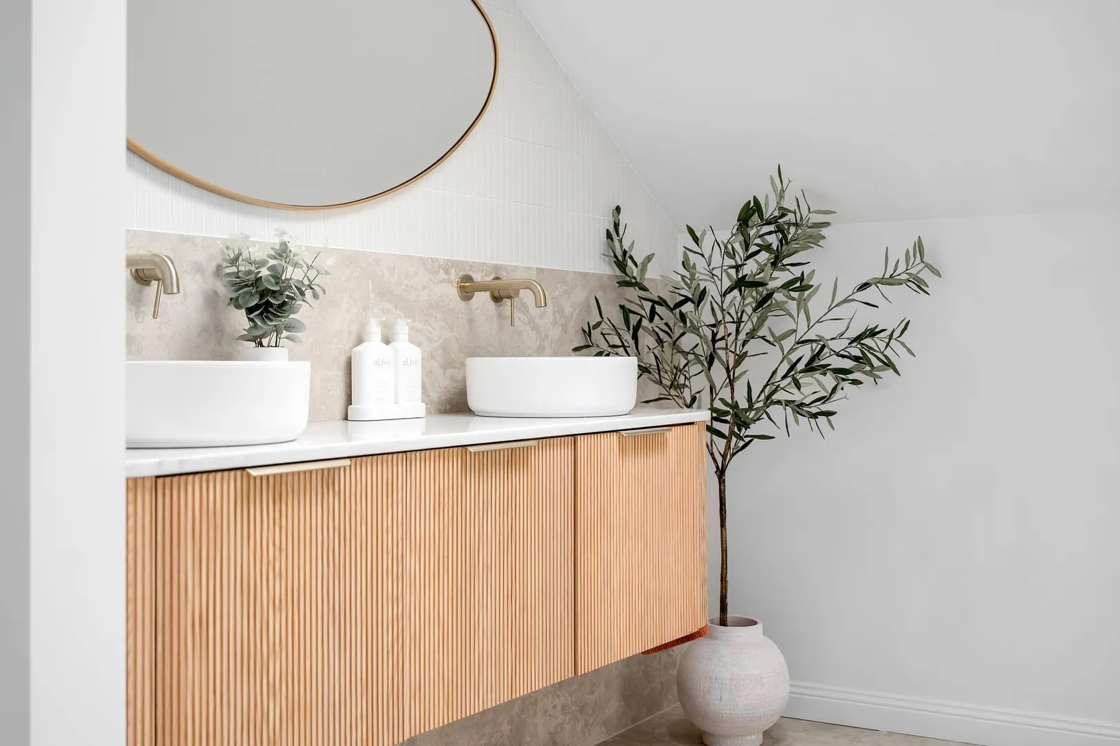 Fluted-timber vanity with brass tapware